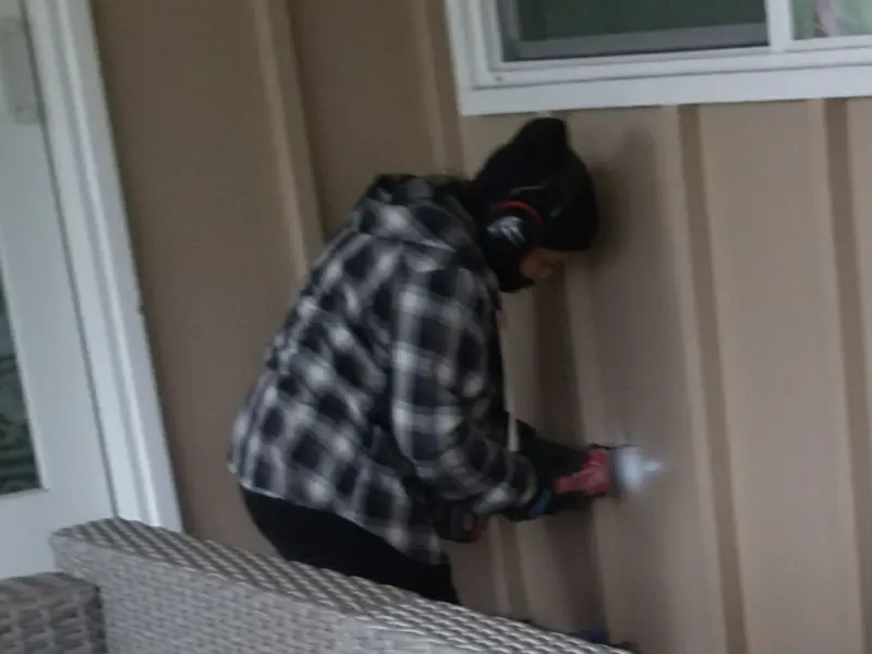Professional electrician installing an exterior outlet in Findlay